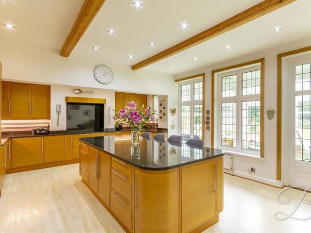 Let's move into one of the main rooms of the house, the beautiful, modern kitchen. Fitted with high-quality wall and base units, with complementary work surfaces, it also has a centre island with breakfast bar, providing an excellent spot for enjoying your morning coffee. The room adjoins the conservatory.