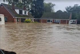 Fryar Road in Eastwood became a lake as residents coped with devastating floods. Photo: Submitted