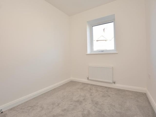 The third and final bedroom at the Kings Court bungalow is the smallest. It has a radiator, two double power points and a double-glazed window facing the front of the property.