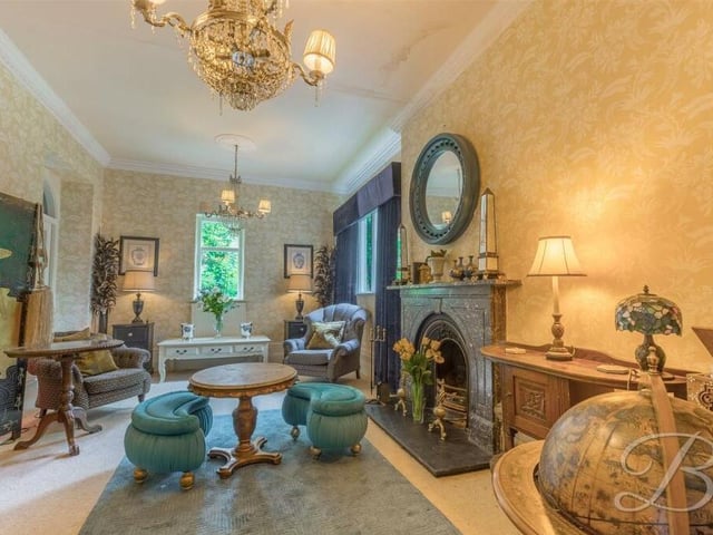 Next stop is this glorious garden room which, in turn, leads to the conservatory. It boasts a feature fireplace and windows to the side and rear of the prioperty.