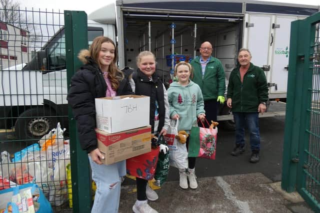 Pupils from The Garibaldi School visit the foodbank to hand over their donations 