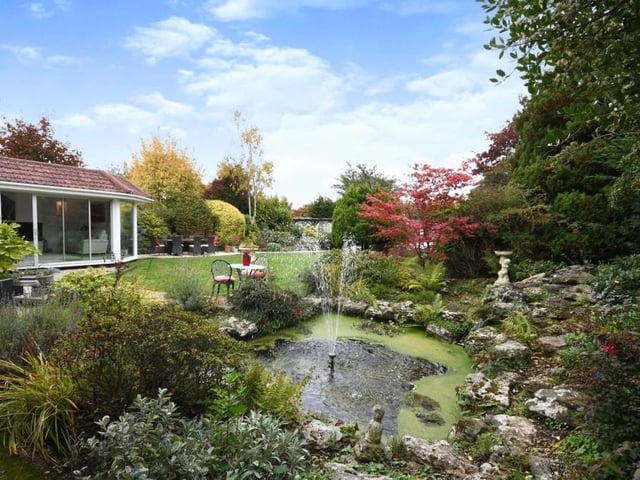 This splendid water feature adds character and charm to the garden at the back of the Lichfield Lane dormer bungalow. In the background is the wonderful summer house.