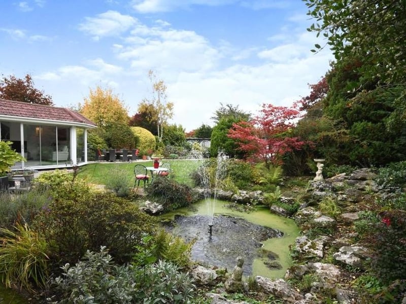 This splendid water feature adds character and charm to the garden at the back of the Lichfield Lane dormer bungalow. In the background is the wonderful summer house.
