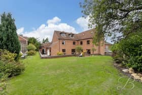 To the rear is an exceptionally large garden, providing an outstanding amount of private outdoor space