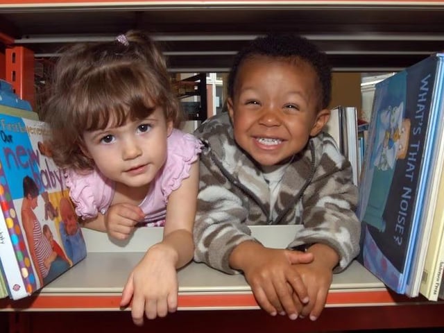 Kady-May Colbourne, aged two at the time, and Reub`en Haines, also two, starting off the Book Crawl at Mansfield Woodhouse Library. Children had the opportunity to meet the Bookstart Bear and to join in a singing session.