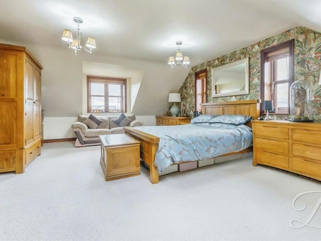 This second photo of the master bedroom emphasises what a vast space it occupies. Triple-aspect windows, as well as a Velux window, make it a bright room too.