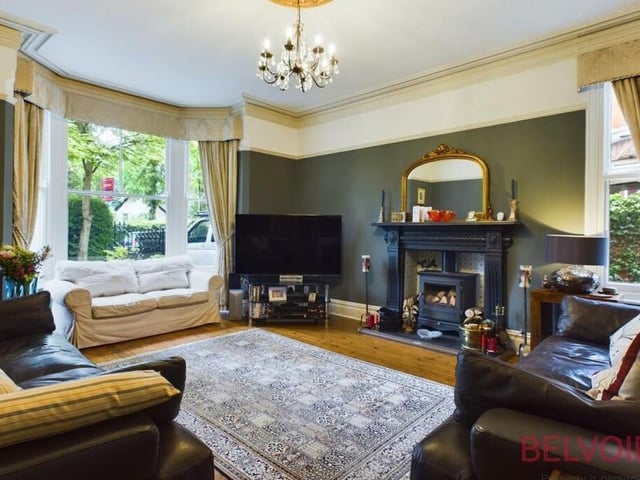 Although large, the lounge or living room is still warm and cosy. A large bay window, plus an additional side window, provide lots of natural light, while a dual-fuel log-burner, set within a beautiful fire surround, makes the room the ideal place to relax. Natural wood flooring, a chandelier and a cast-iron radiator complete the finishing touches.