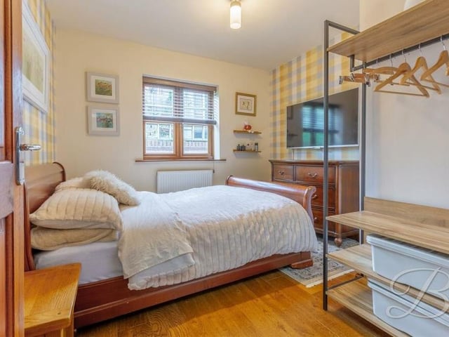 One of the three bedrooms is currently downstairs. But it is a versatile space that could be put to multiple uses, depending on what you require. The window overlooks the back of the house.