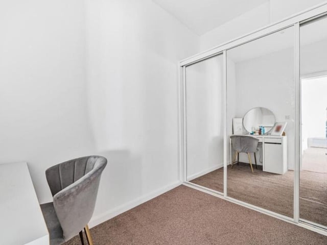 The main bedroom has access to a walk-in wardrobe, which has been converted from the property's fourth bedroom -- and could easily be converted back again if required.