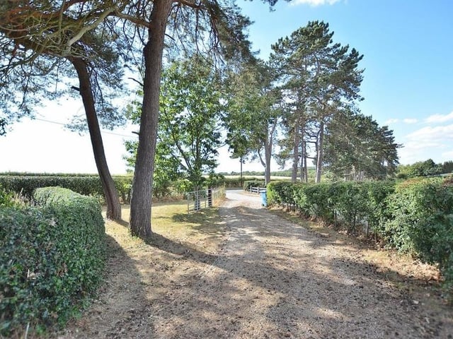 The sweeping gravel driveway that leads from Blidworth Lane to the £450,000 four-bedroom property.