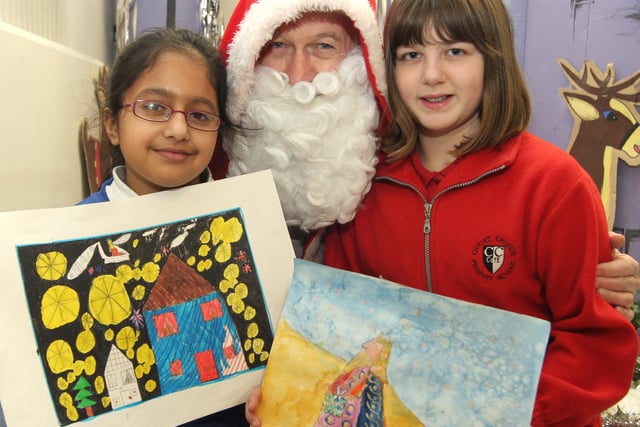 Christmas poster winners Athaka Khan and Libby Pattison with Father Christmas pictured in 2007
