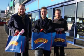 Paul Wheeler, chief executive and director of Mansfield Building Society, Executive Mayor Andy Abrahams and Wayne Leatherhead, manager of Smyths toy shop in Mansfield