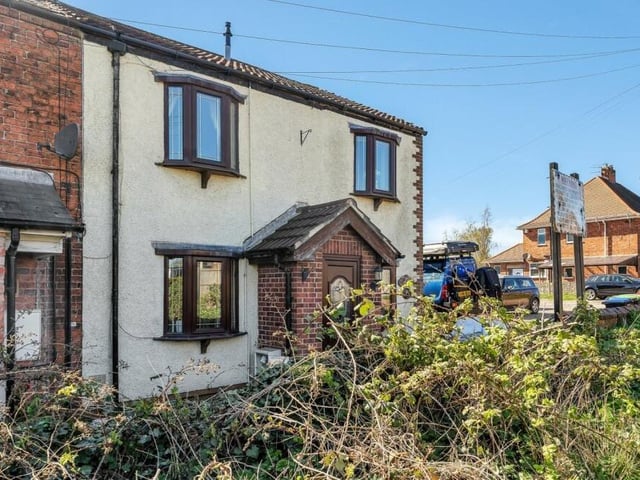 Let's step outside again, and here is a shot of the cottage frontage. The property sits towards the end of Lea Lane, where a pleasant row of terraced cottages can be found.