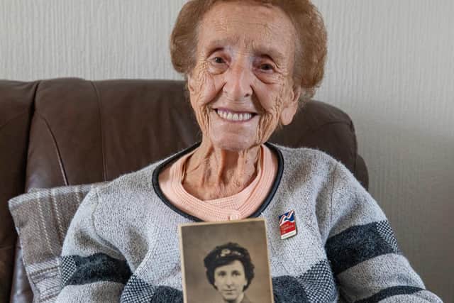Margaret Wilson, holding a photo of herself during her military days, will be march at the Cenotaph in London on Remembrance Sunday. Photo: Richard Cannon