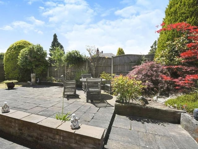 As we say farewell to the Chatsworth Drive bungalow, there's just time to check out the enclosed rear of the property, where a raised seated patio area could hardly be a better place to soak up the summer sun.