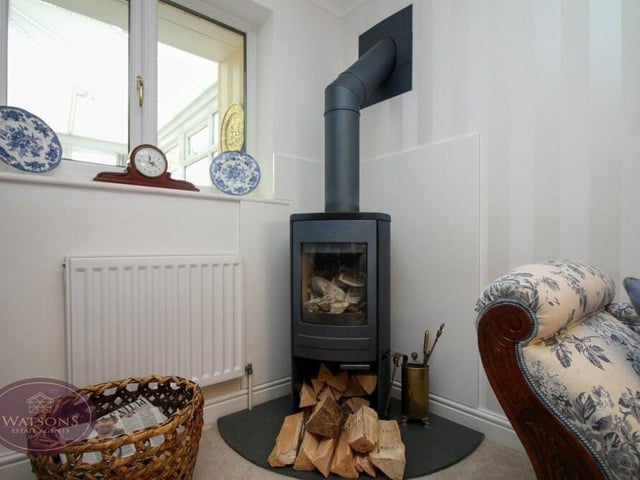 In one corner of the lounge at the £450,000-plus property is this attractive log-burning stove.