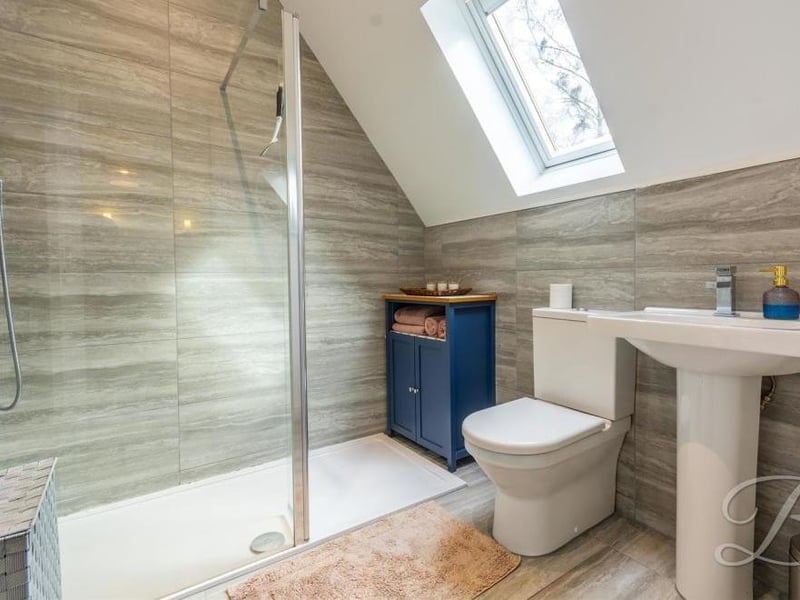 Here is the third en suite shower room at the house.It consists of a walk-in shower, low-flush WC and wash hand basin.