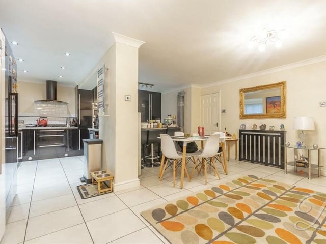 The open-plan kitchen/diner offers space and style. There is an integrated double oven, hob with extractor fan above and space for an American fridge/freezer, as well as a breakfast table.