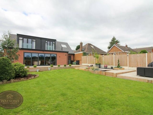 The turfed lawn in the back garden is well maintained.