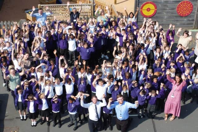 Pupils and staff celebrating at The Bramble Academy.