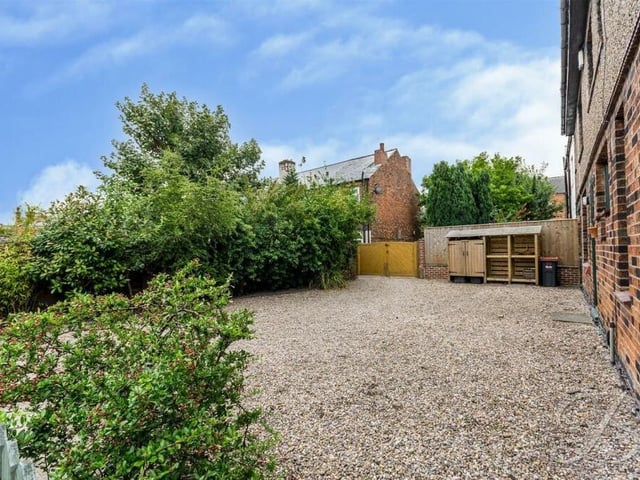 A gravelled driveway at the front of the £400,000 house provides plenty of off-street parking space.