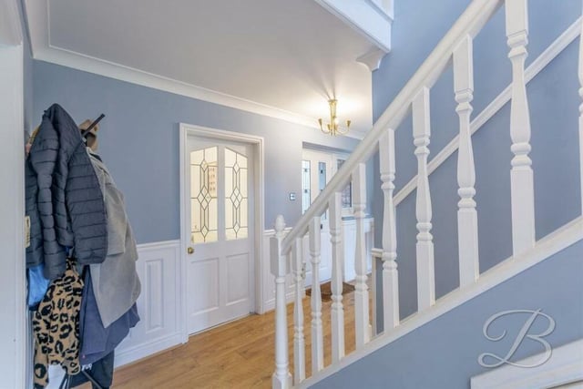 As you step through the front door of the £450,000 Kings Lodge Drive property, you are greeted by this inviting entrance hall, with access to all the ground-floor rooms.