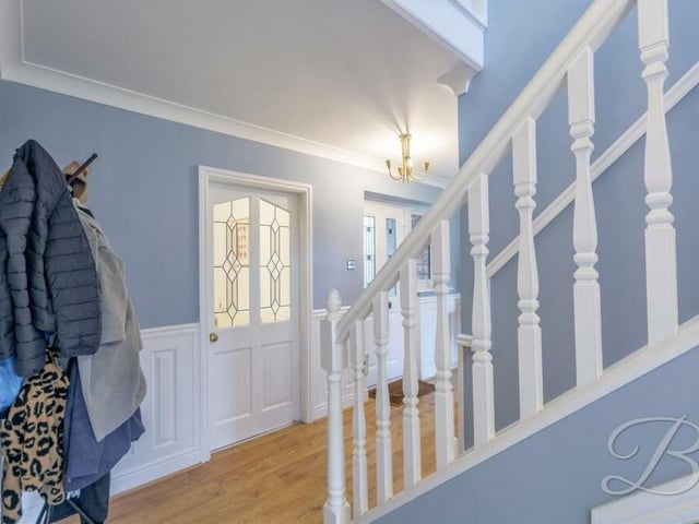 As you step through the front door of the £450,000 Kings Lodge Drive property, you are greeted by this inviting entrance hall, with access to all the ground-floor rooms.