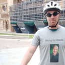 Jason Hanson outside Lincoln Cathedral at the start of his ride