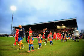 Mansfield Town Football Club, or 'The Stags', are currently in League Two, while Chesterfield's football club are in The National League, the league below.