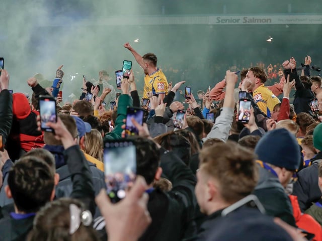 Mansfield Town's fans and players celebrated promotion to League One long into the night.