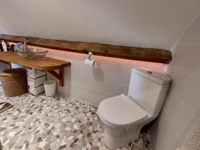 The newly installed en suite from a different angle. Don't you just love the quirky hand wash basin, favoured by the current owners?