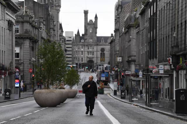 A pedestrian walks on an empty street on August 5, 2020 in Aberdeen, Scotland.(Photo by Jeff J Mitchell/Getty Images)