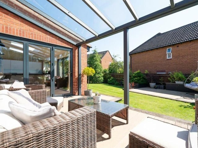 A view from inside the sheltered terrace, overlooking the rest of the rear garden at the Bryony Way property.