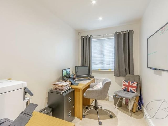 The comp[act but versatile fifth bedroom can easily be converted into a home office or study. It has a carpeted floor.