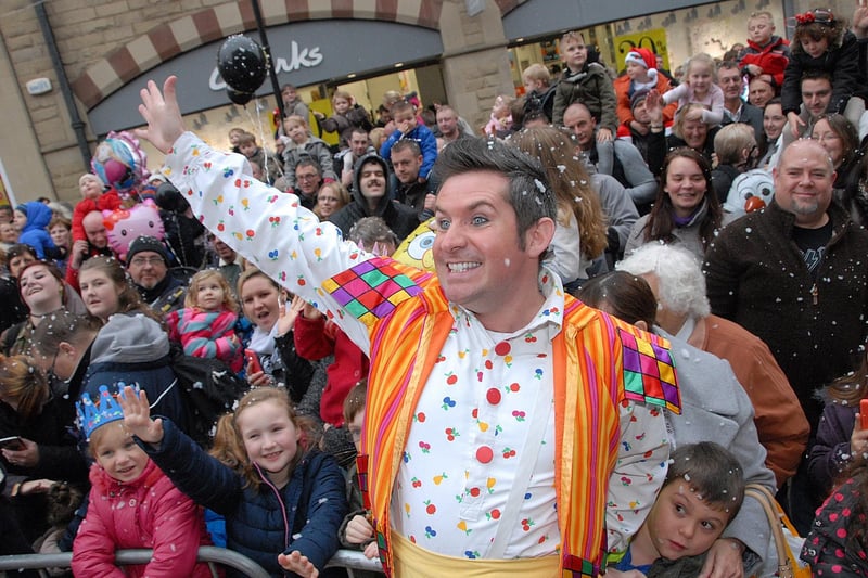 Panto star Silly Billy,(Adam Moss) meets the crowds at the Christmas lights switch-on in 2014.