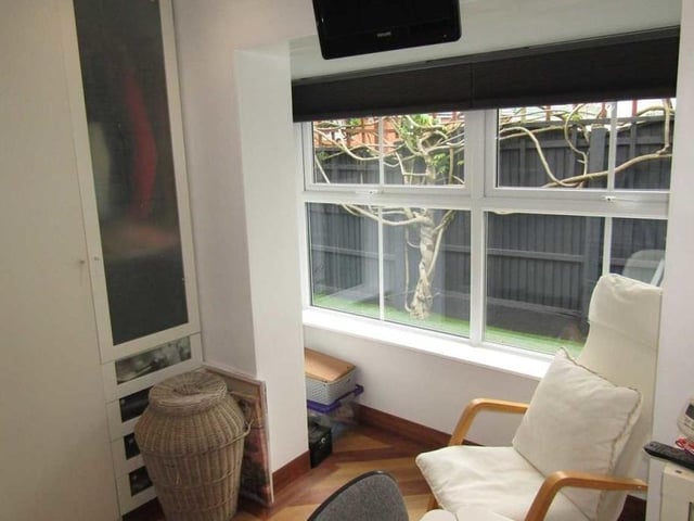 Bedroom number two is more compact than the first but there is still space for fitted wardrobes. A double-glazed window faces the front of the property.