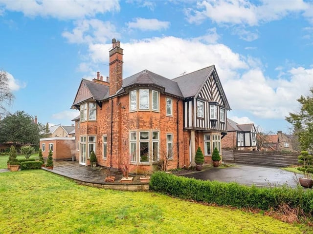 An Edwardian and substantial detached residence across three floors (5,467 sq ft) with seven bedrooms, four bath/shower rooms and six reception rooms, together with a substantial detached coach house/double garaging with an adjoining workshop and room above (1,079 sq ft), set back behind a secure gated entrance.