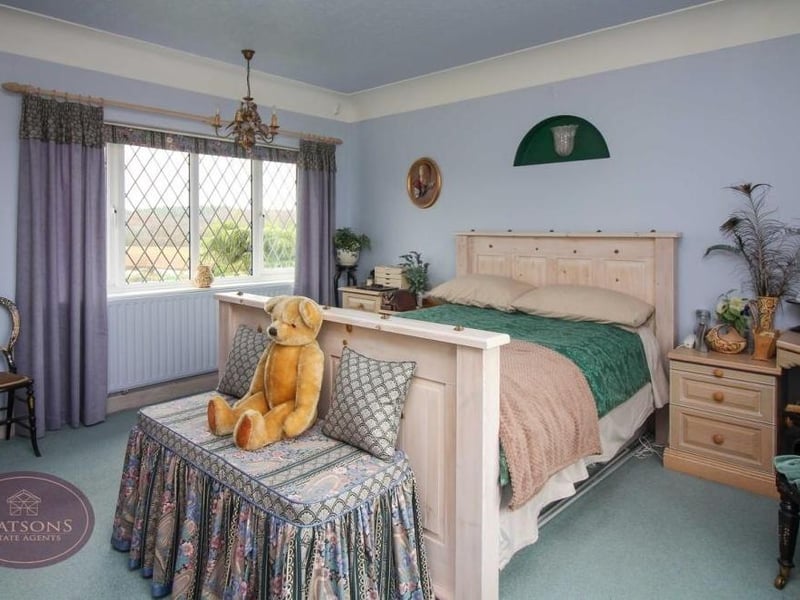 There are three good-sized bedrooms on the first floor. This is the main one, which has fitted wardrobes and windows overlooking the front and back of the £425,000 property. Teddy loves it!