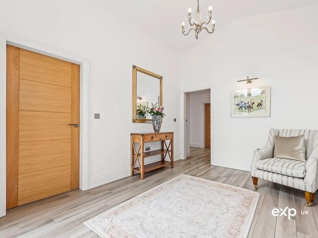 The hallway makes easy connections to the accommodation. The tasteful décor continues with the tiled flooring and the comfort of underfloor heating, along with the addition of down lighting.