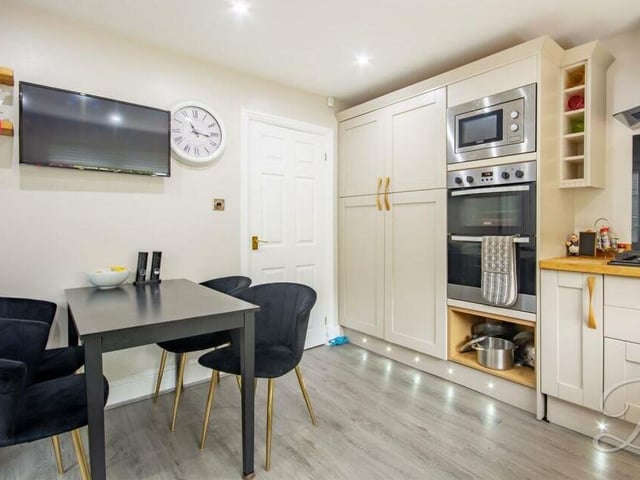 As you can see, the kitchen has plenty of space for a breakfast table. Conveniently, the door leads outside.
