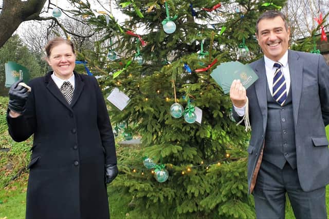 Joanne Hutsby and Anthony Topley, partners at Gillotts Funeral Directors, in Nottingham Road, Selston, launch the company’s Christmas Tree Remembrance appeal which will help Selston Community Food Bank this year.