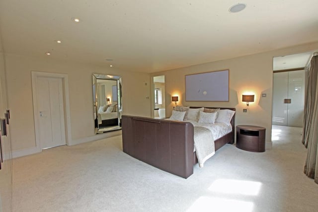 The master bedroom suite comprises a lovely bedroom with good fitted cupboards, overlooking the front garden, a large dressing room with further fitted cupboards, a door from the bedroom leads into a sitting room with staircase down to the utility room.