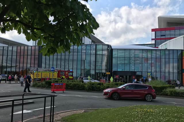 A vehicle has driven into the entrance of the busy hospital