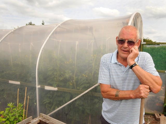 Alex Armit next to his polytunnel at Selston Allotments.