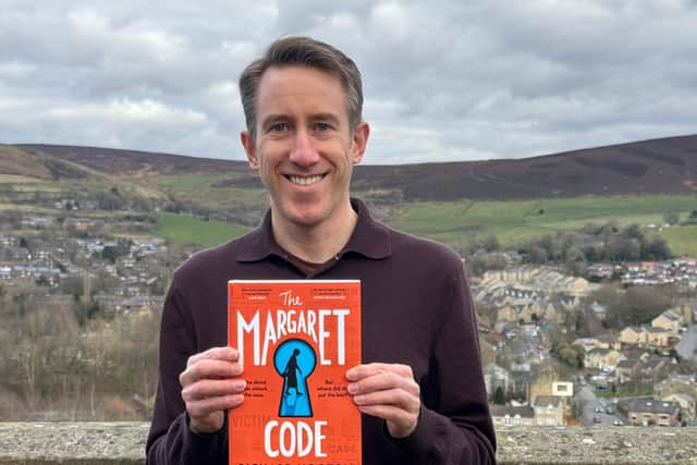 Richard Hooton with his novel The Margaret Code
