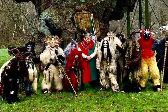 A terrifying collection of scary 'Krampus' creatures (from the Whitby Krampus Run group) gathered at the Major Oak in Sherwood Forest.