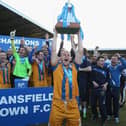 Adam Murray lifts the trophy as Mansfield Town celebrate promotion to the Football League on April 20, 2013.