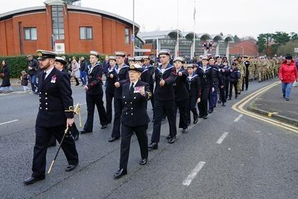Those in uniform pay their respects.