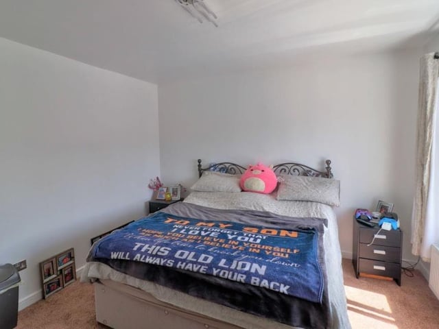 The first of the upstairs bedrooms is a good size, with a carpeted floor and uPVC double-glazed window.