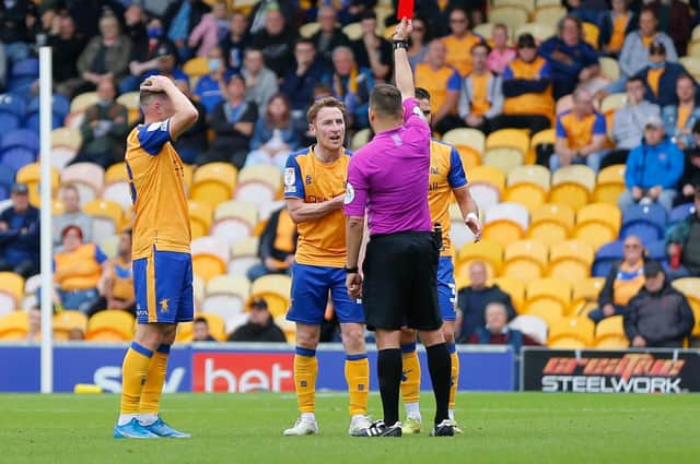 Referee Paul Howard issues Mansfield Town midfielder Stephen Quinn a red card - Pic Chris Holloway.
